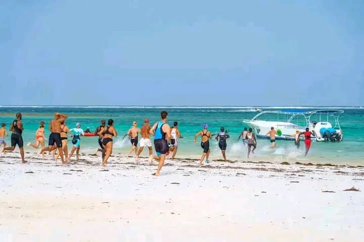 Beach Triathlon: Athletes Sprint into the Indian Ocean